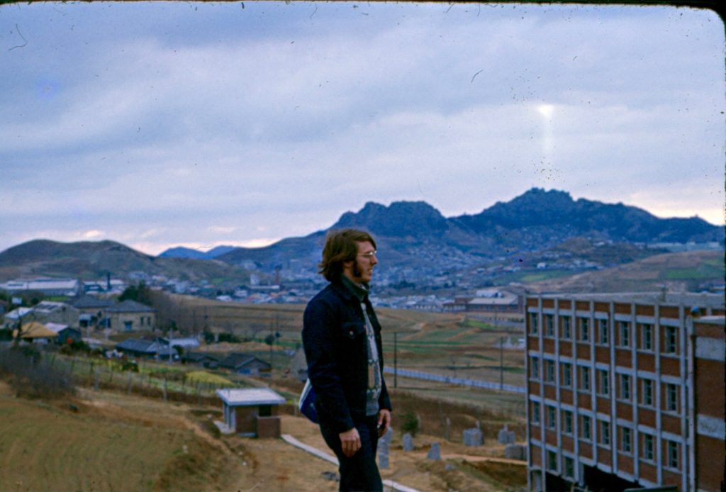 Kwangju 1973. This is a photo of Baker standing on the hill behind the middle school where he taught English. 
