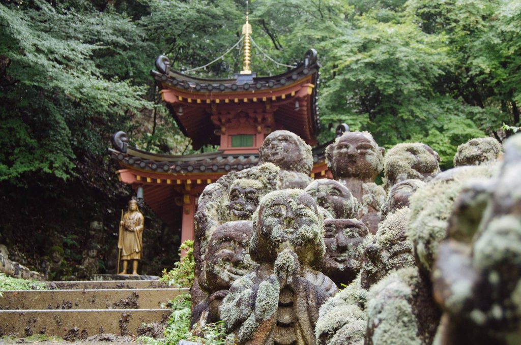 Stone rakan statues at Otagi Nenbutsu-ji, Kyoto. Photo taken by William Strausser.